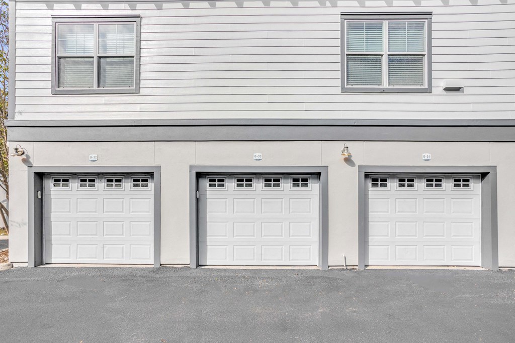 three garage doors on the side of a house