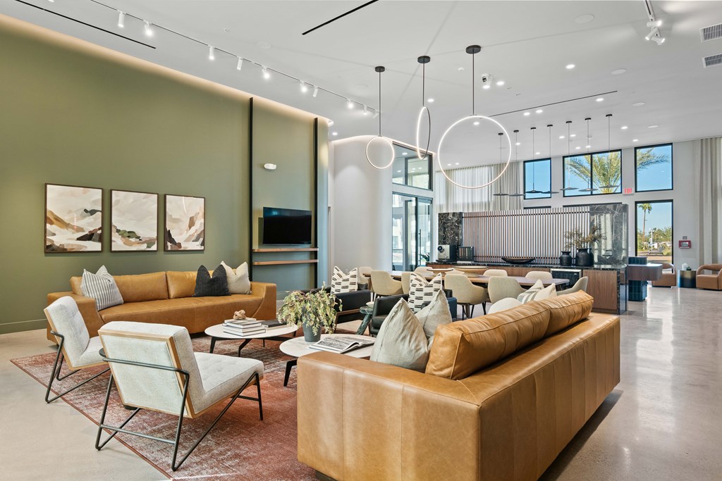A modern living room with a brown sofa and a television.