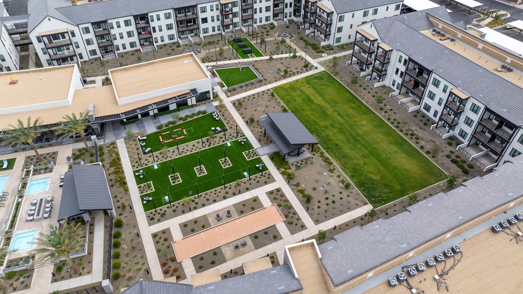 A bird's eye view of a courtyard surrounded by buildings.