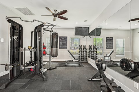 A well-equipped gym with a variety of exercise machines.at Greys Harbor at Lake Norman, Huntersville, 28078