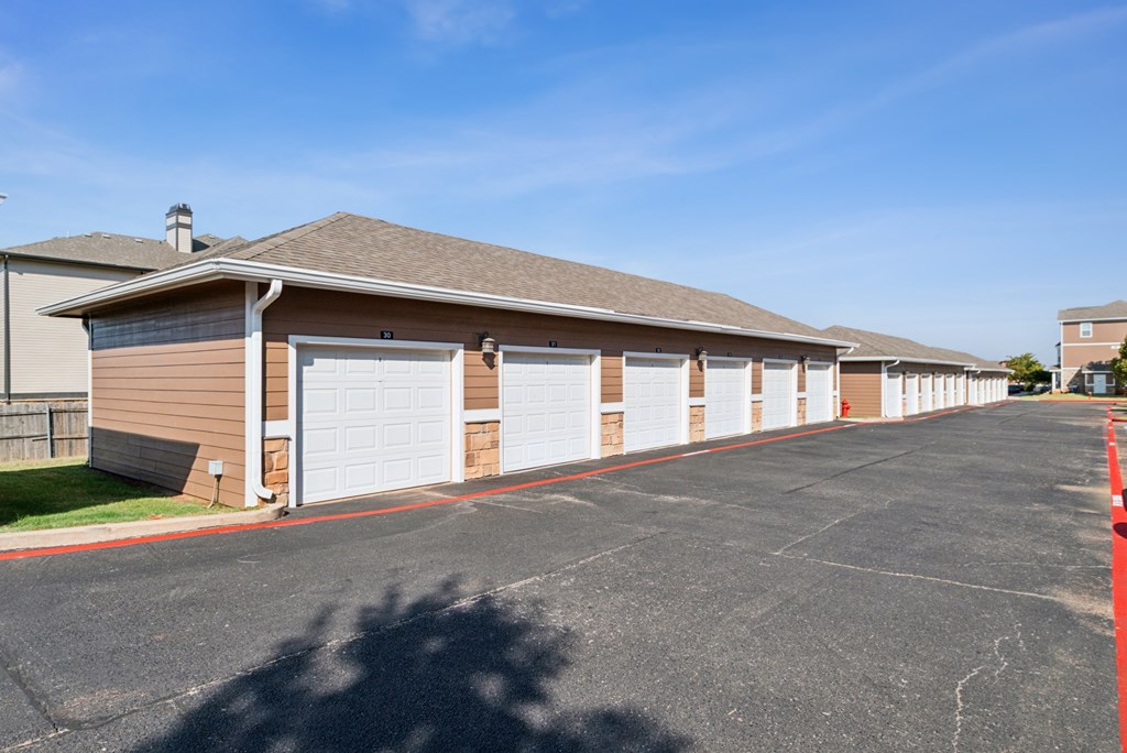 A long row of garage doors are closed.