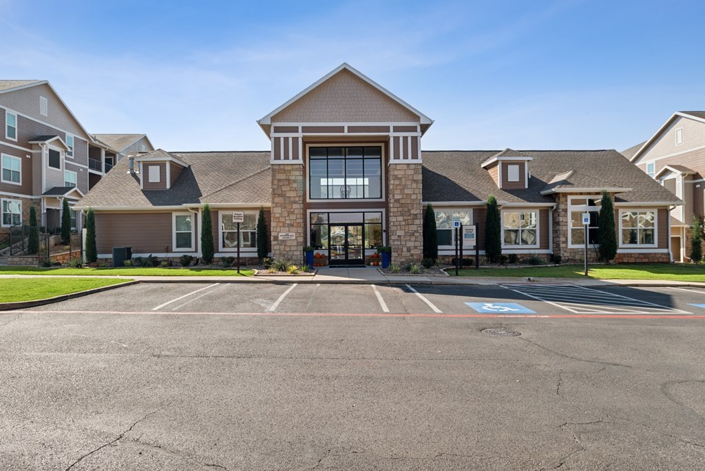 A large building with a parking lot in front of it.
