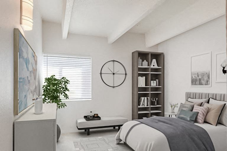 A bedroom with a bed, nightstand, and a plant.