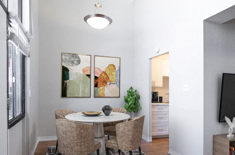 a dining room with a table and chairs