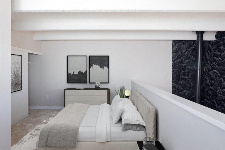 a white bedroom with a bed and a black and white wall