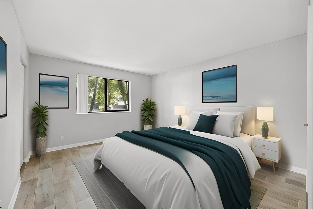 a bedroom with a bed and three windows