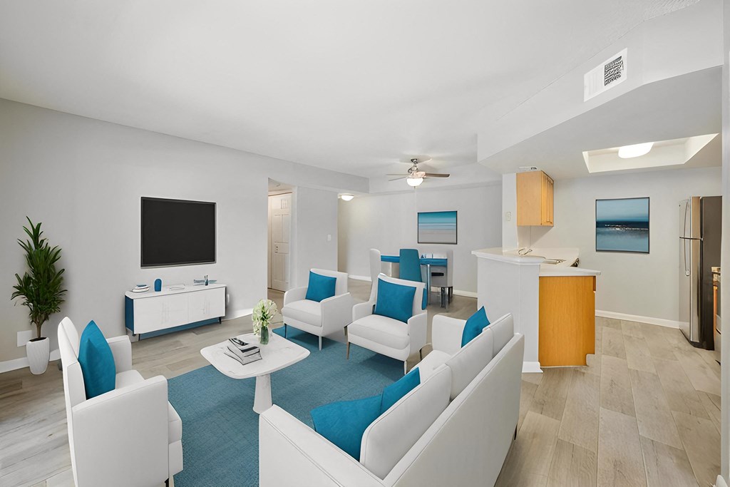 a living room filled with furniture and a flat screen tv