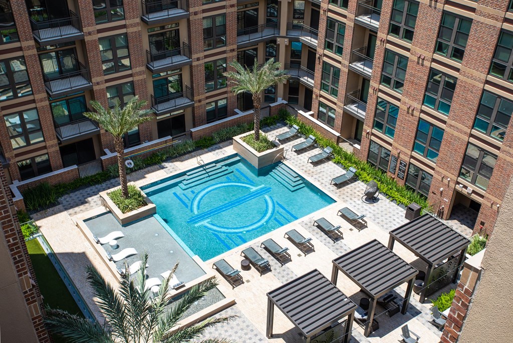 a large swimming pool in front of a building