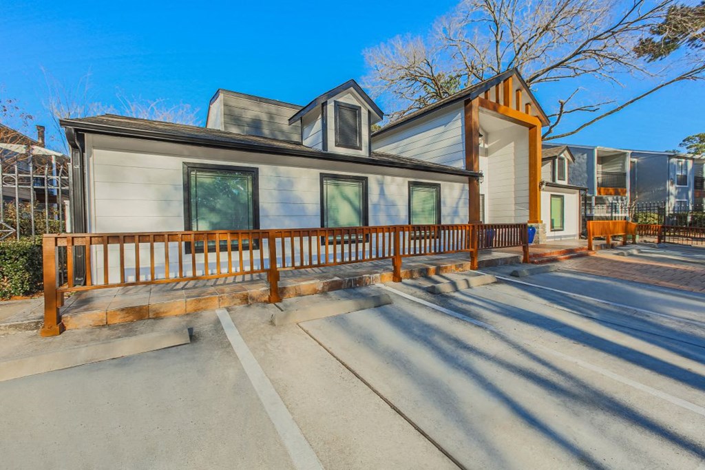 A modern house with a wooden fence in front  at Cashel Springs, Houston.