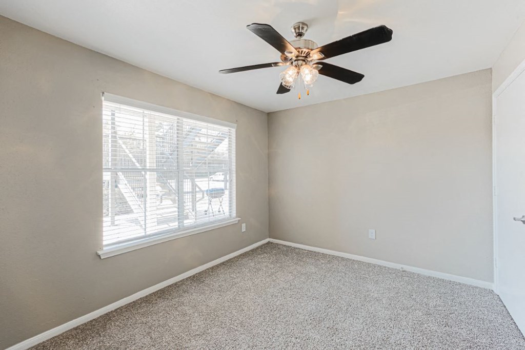 bedroom with ceiling fan in west houston luxury apartments
