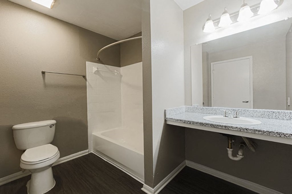 bathroom with vanity mirror in west houston luxury apartments