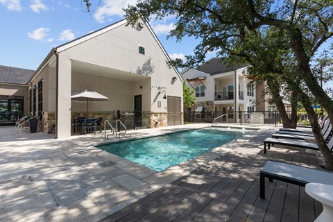 A modern house with a pool in the backyard.