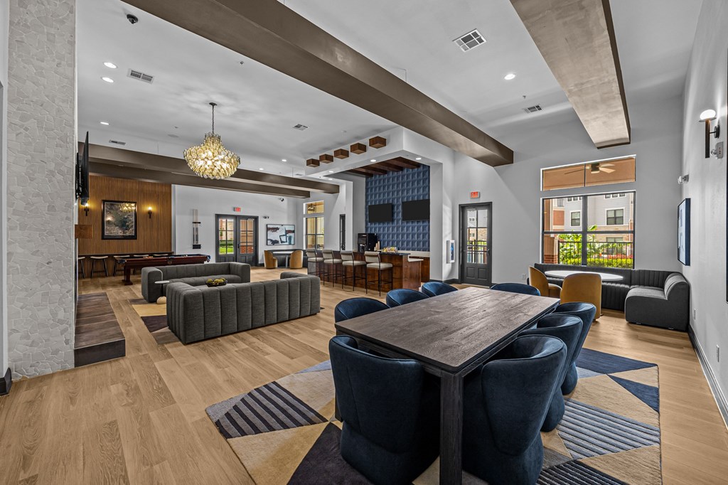 A large room with a long table and chairs.