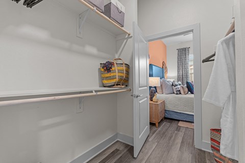 A small bedroom with a bed and a wardrobe.