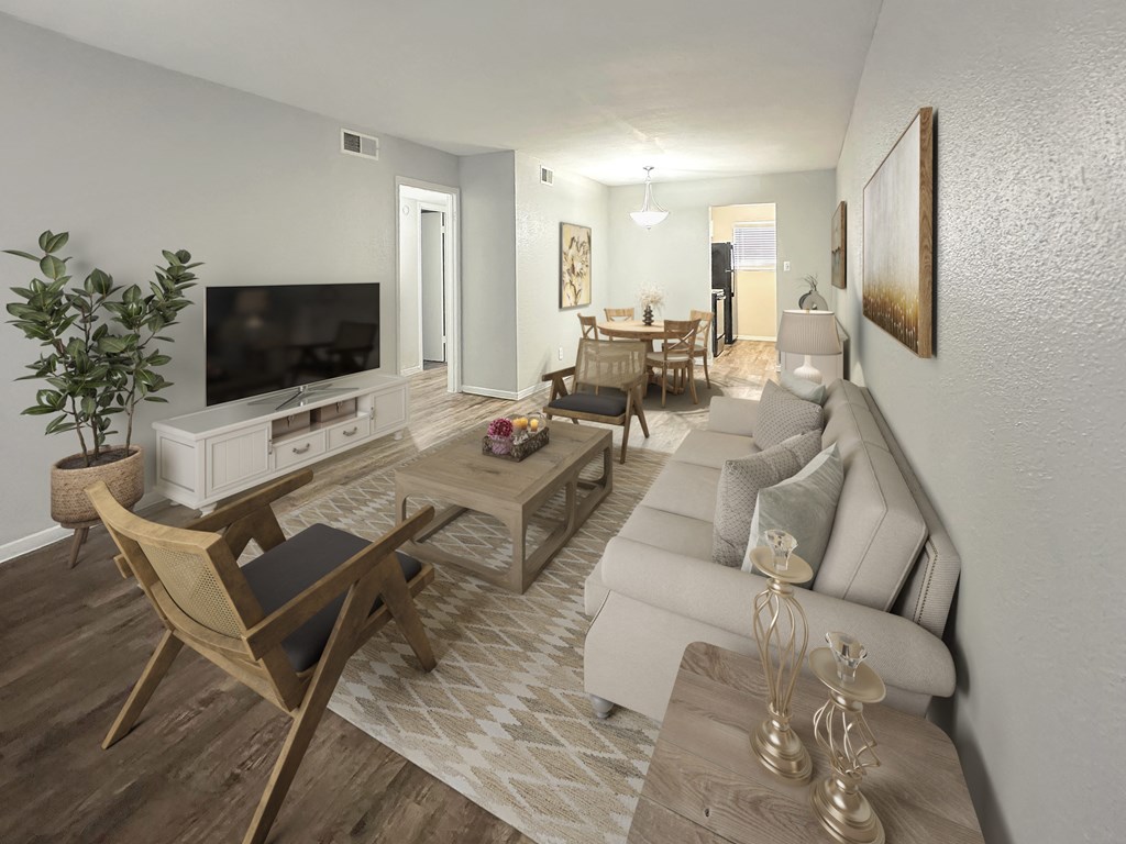 a living room and dining room with a couch and a tv