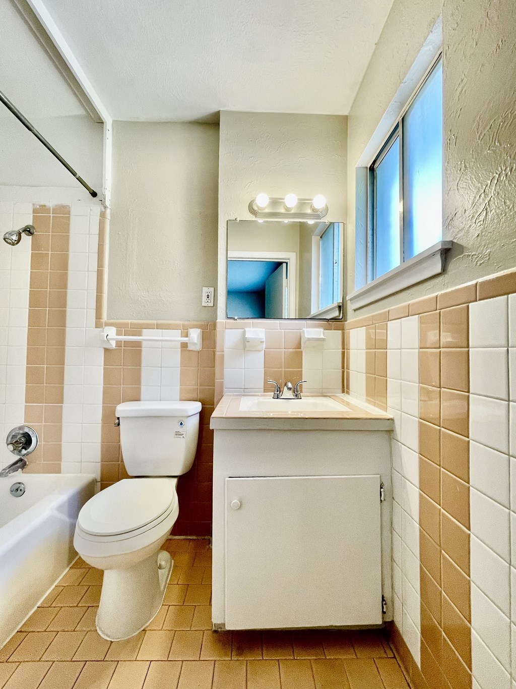 a bathroom with a toilet sink and a mirror