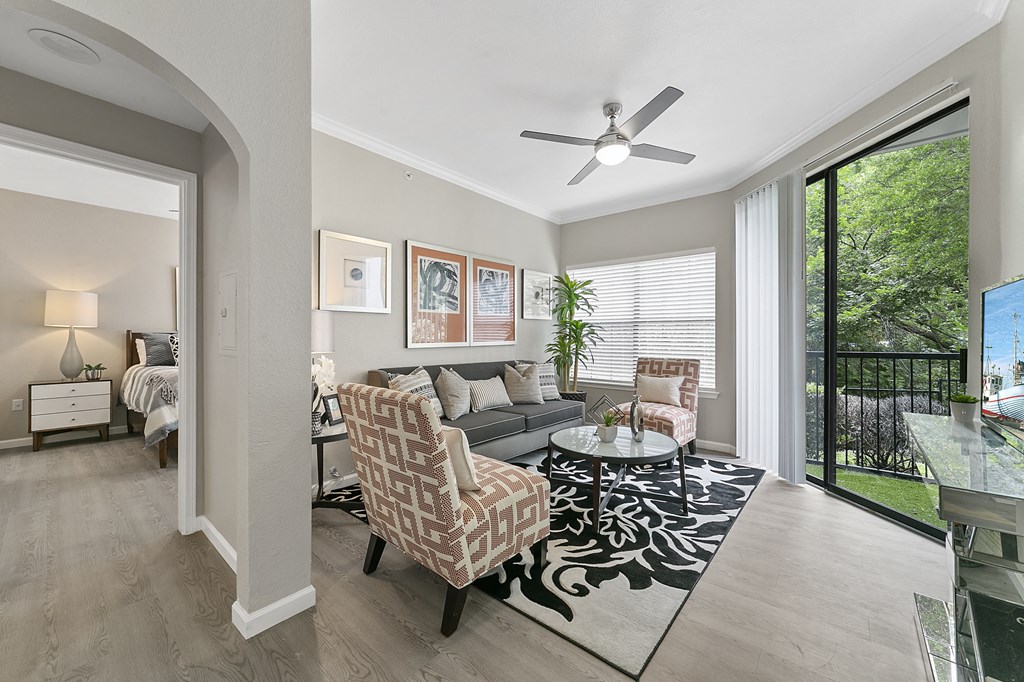 a living room with a couch and two chairs