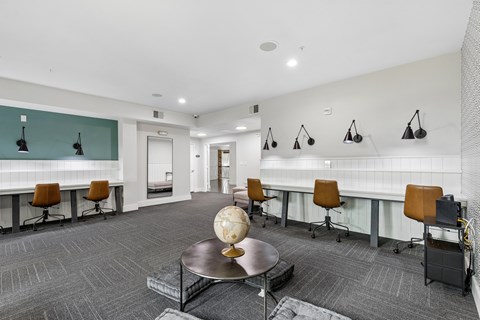 A conference room with a table, chairs, and a globe on the table.