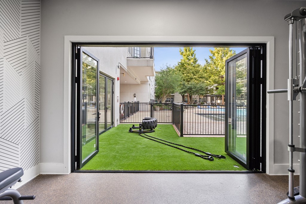 A view of a backyard through a glass door.