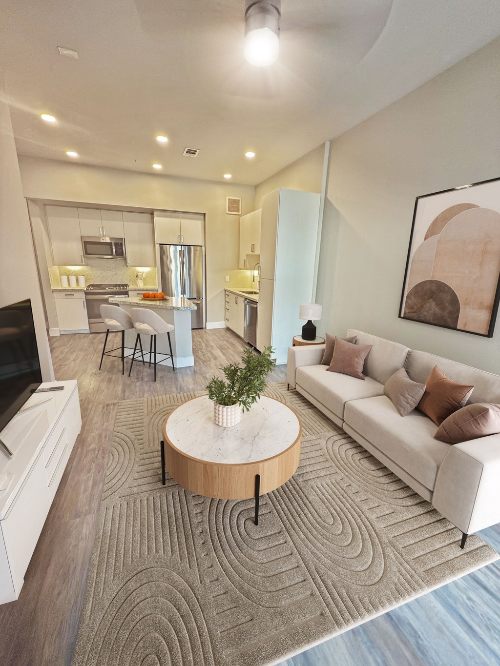A modern living room with a white sofa and a wooden coffee table.