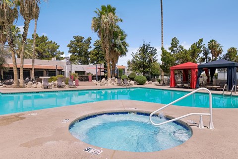 A small round pool with a white ladder.