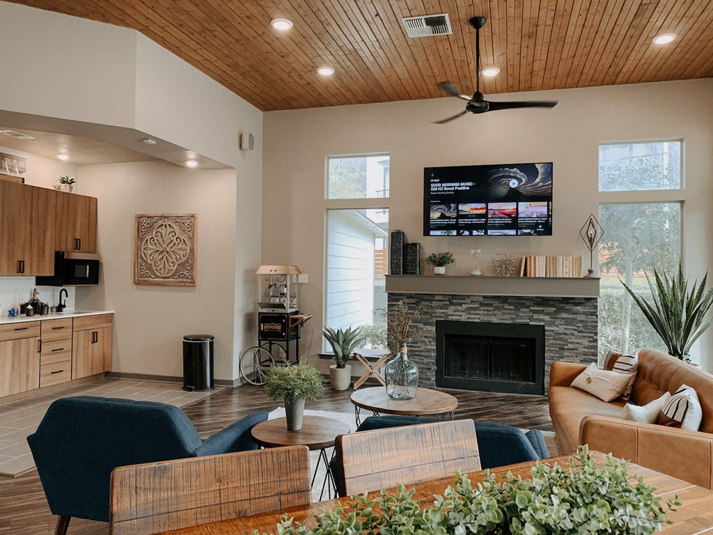 the view of a living room with a fireplace and a tv