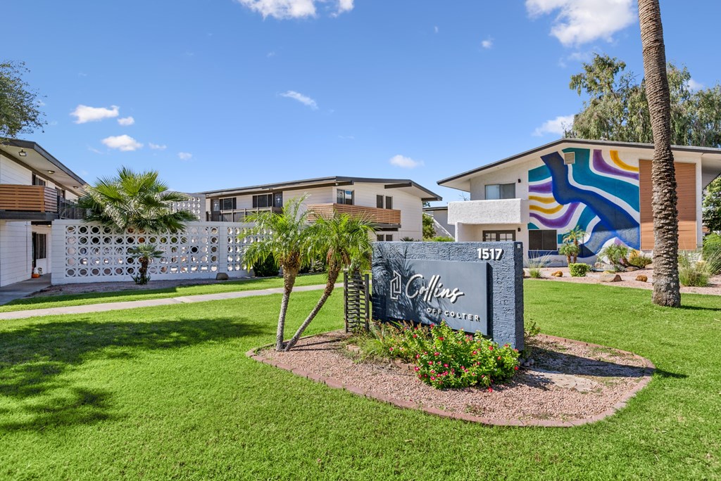 A sign in front of a building that says "Gillis".