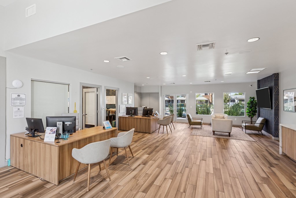 A reception area with a desk and chairs.