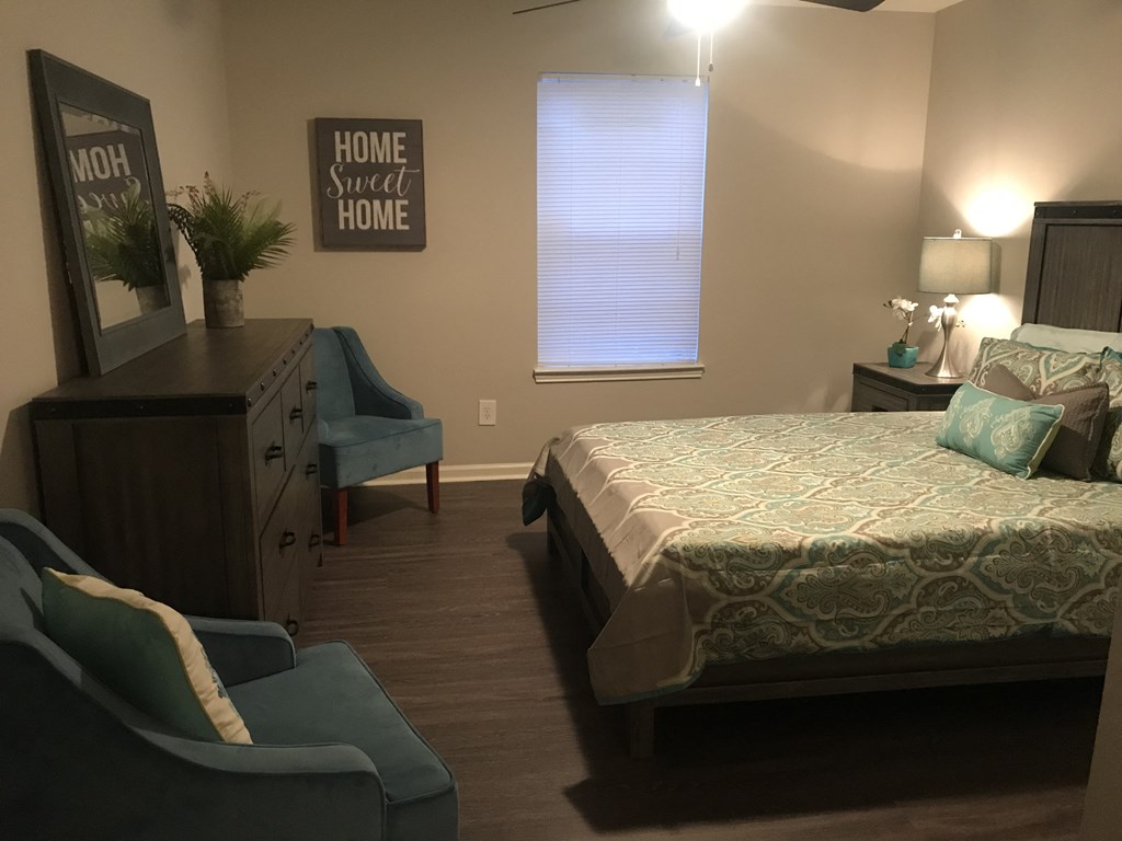 a bedroom with a bed and a dresser