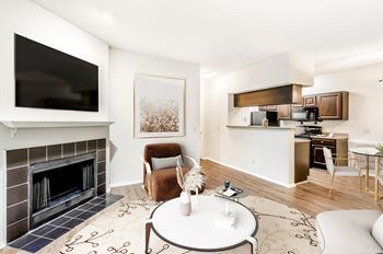 a living room with a fireplace and a table
