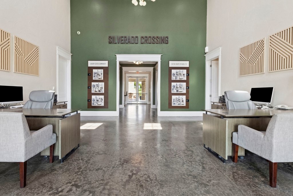 A reception area with a green wall and a sign that says Silverado Crossing.