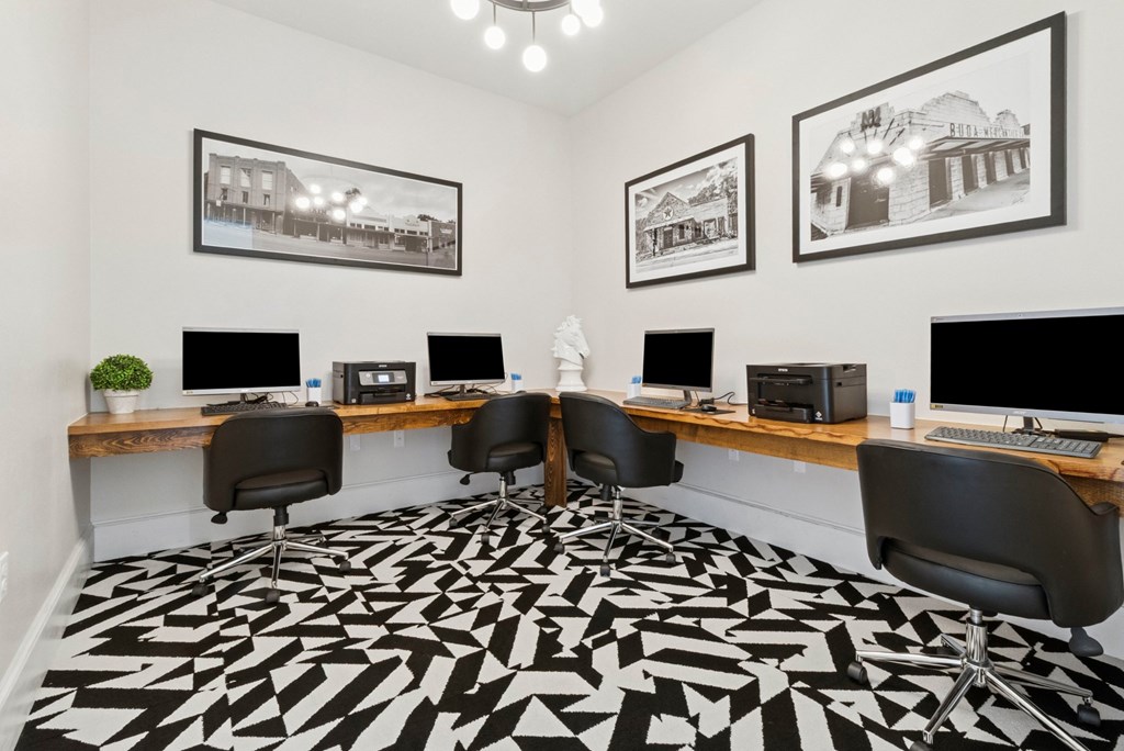 A black and white patterned carpet covers the floor of a modern office.