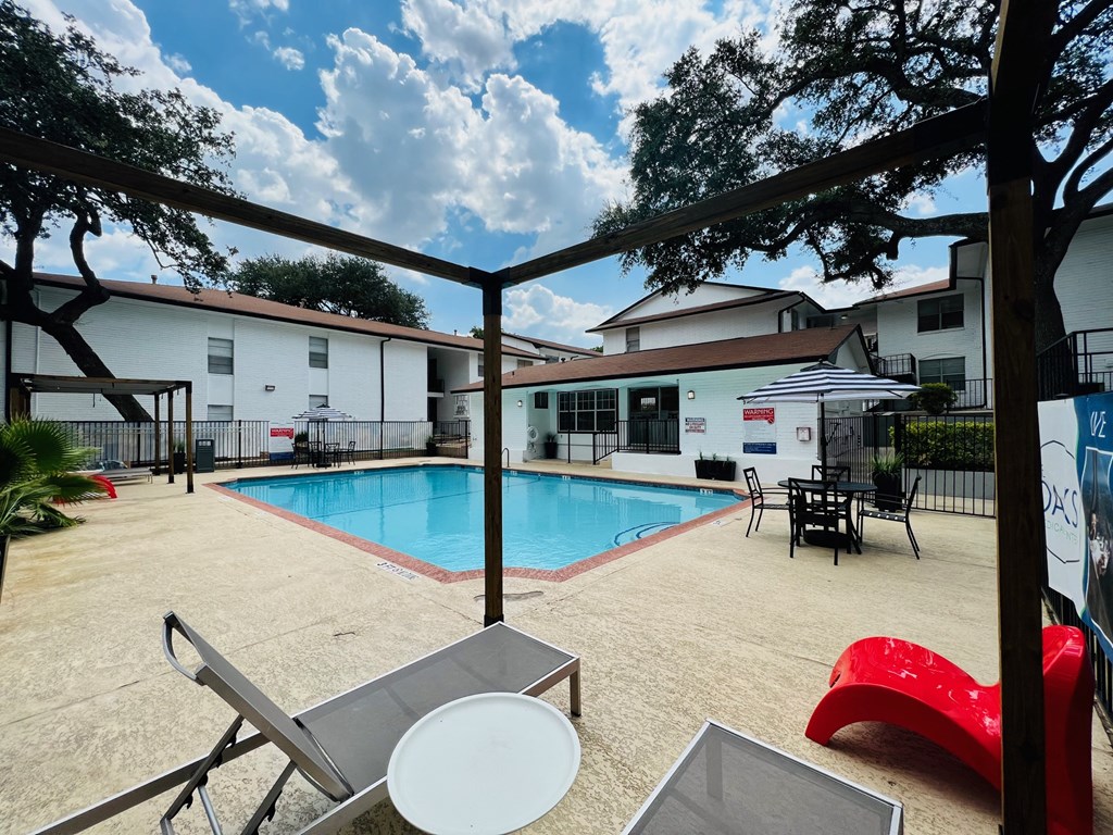 our apartments have a large swimming pool and outdoor furniture