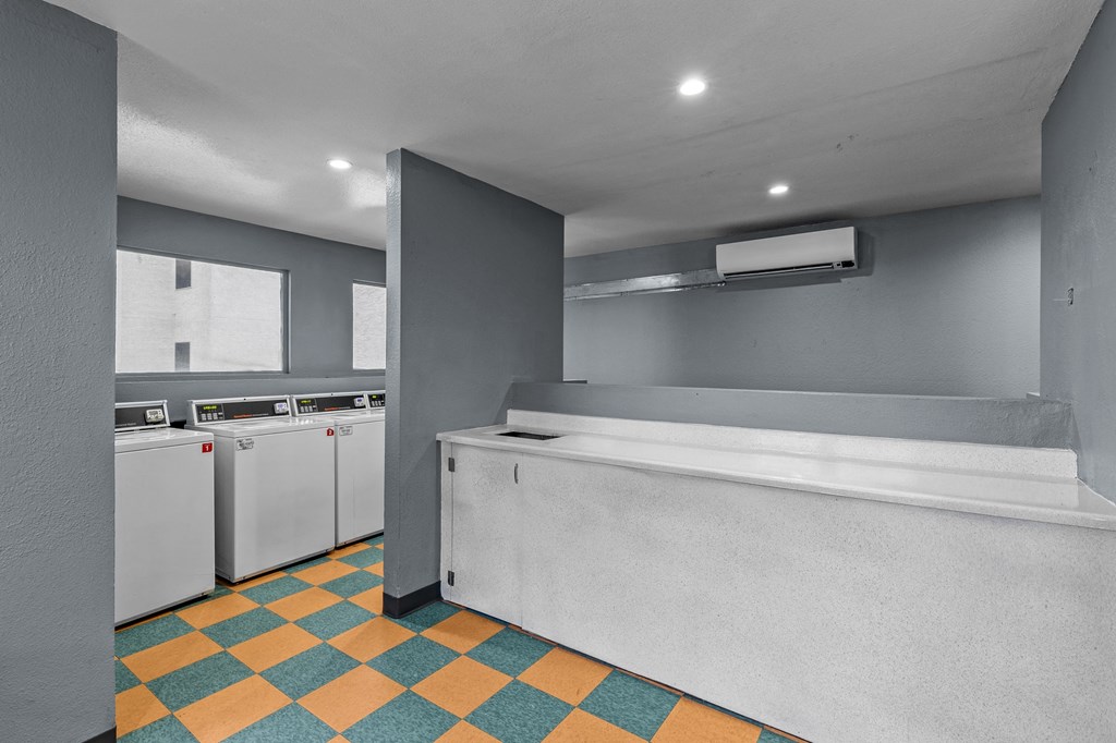 a laundry room with a washer and dryer