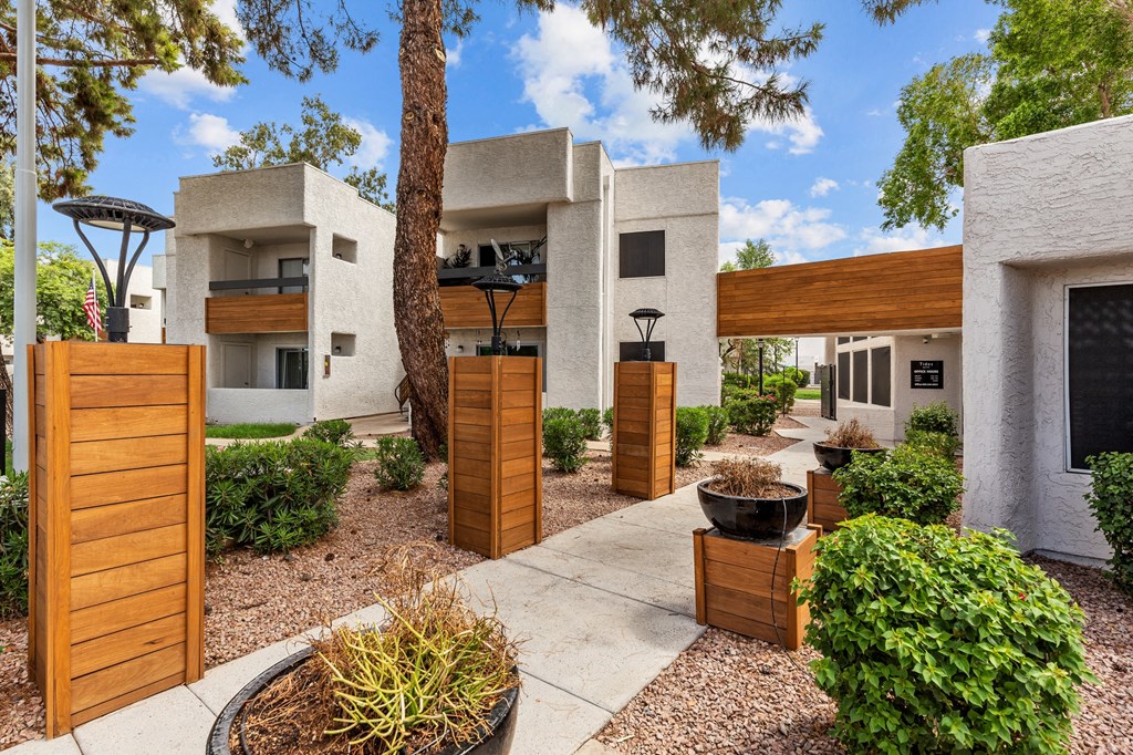 a courtyard with trees and plants