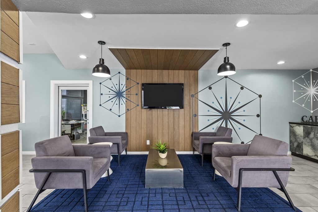 a room filled with furniture and a flat screen tv