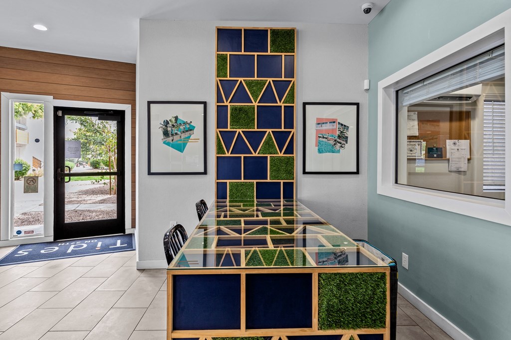 a glass table with a geometric design in front of a door