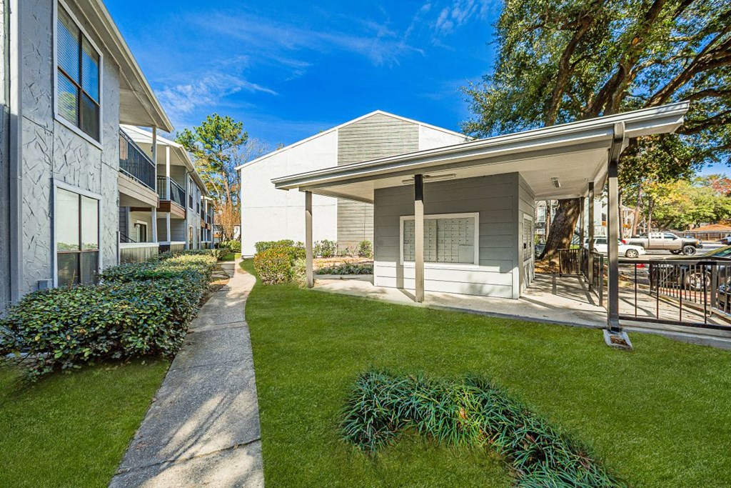 A residential area with a house and a well-maintained lawn  at Cashel Springs, Houston, TX, 77069.
