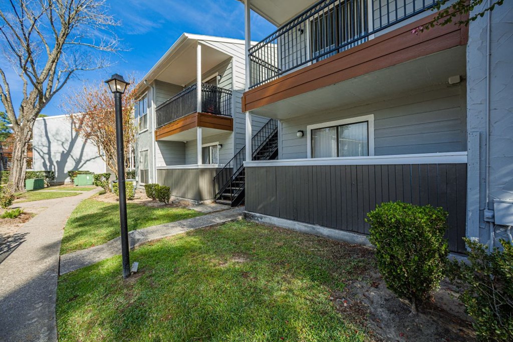 A building with a balcony with trees around   at Cashel Springs, Houston