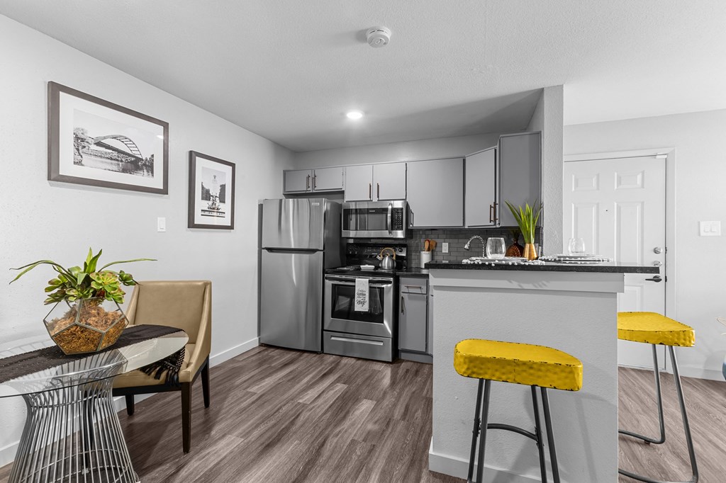 our apartments offer a kitchen and living room with stainless steel appliances
