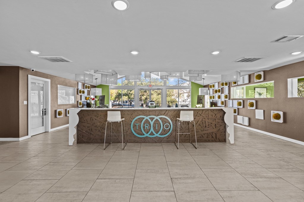 the lobby of the olympic club with a bar and chairs