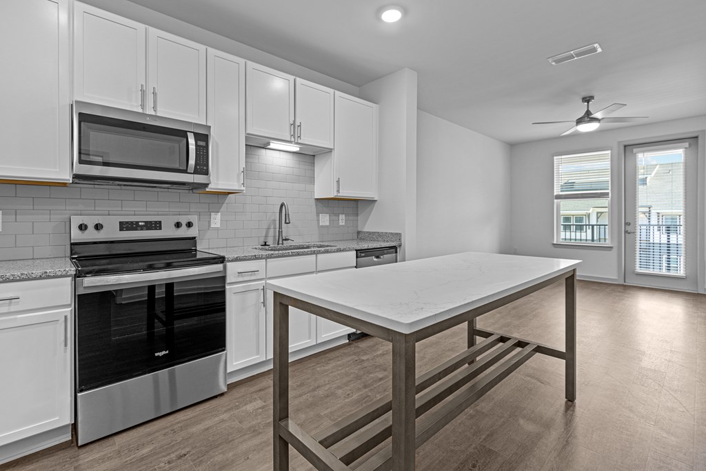 A modern kitchen with a large island in the middle.