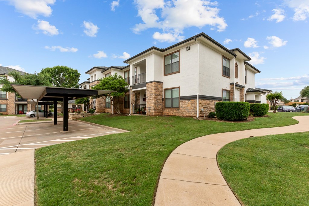 A modern two-story building with a covered walkway in front.