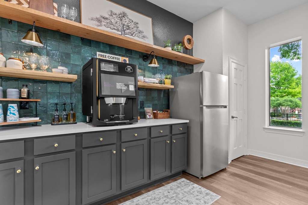 A kitchen with a coffee machine on the counter.