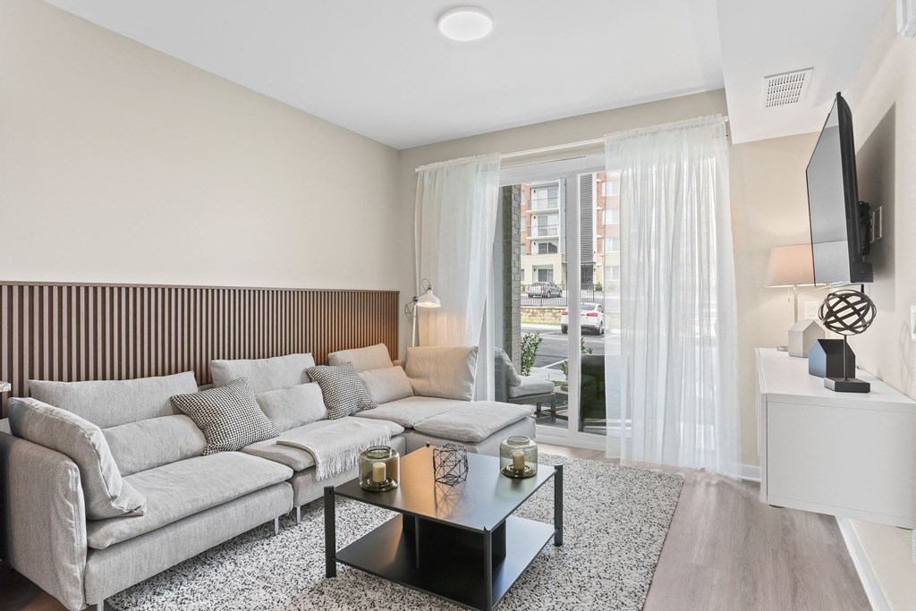 a living room with a large couch and a coffee table