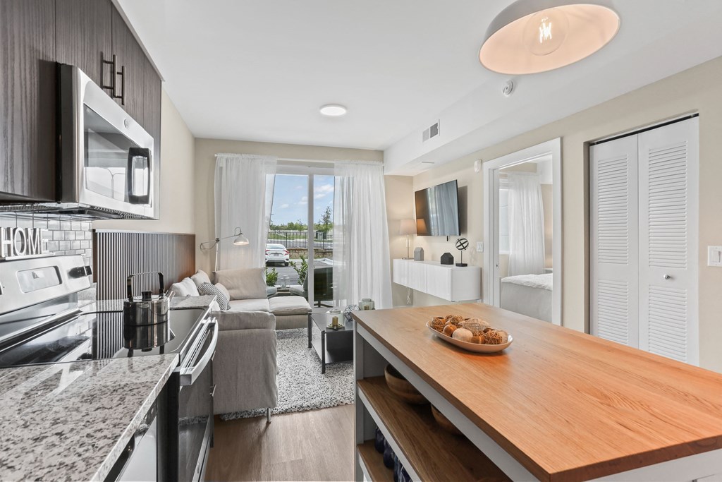 a kitchen and living room in a 555 waverly unit