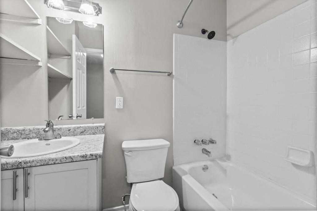 a bathroom with a sink toilet and a bath tub