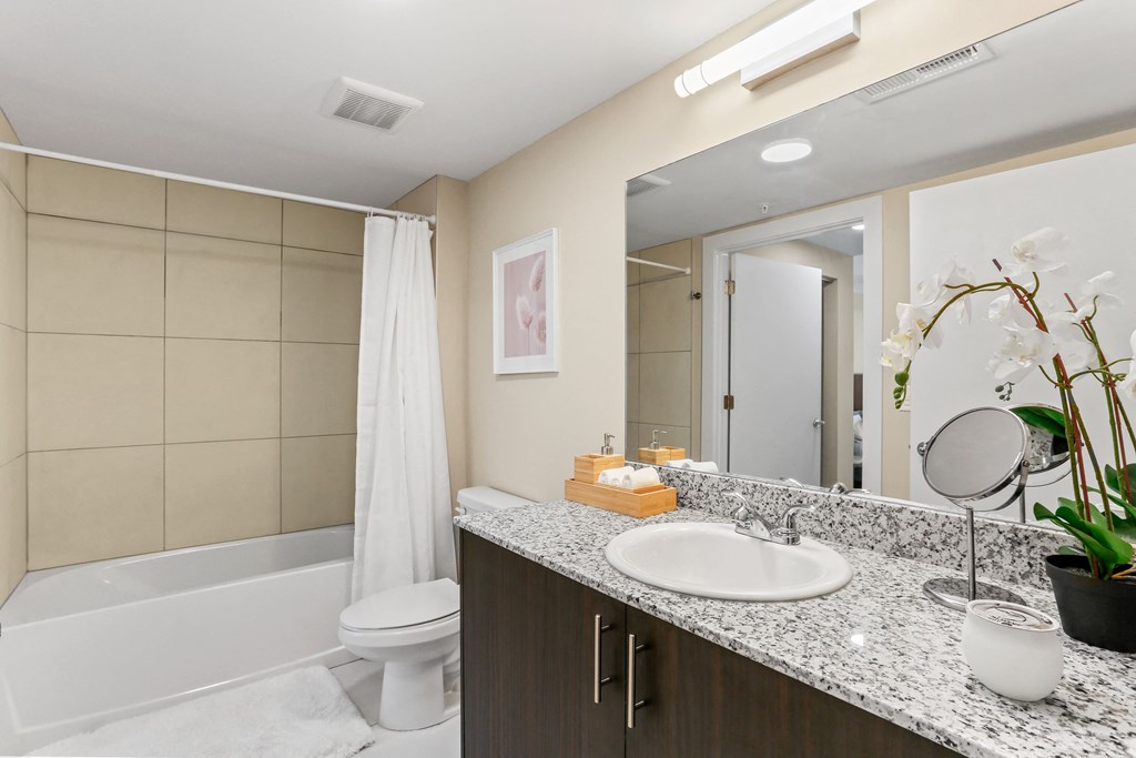 a bathroom with a toilet sink and bathtub
