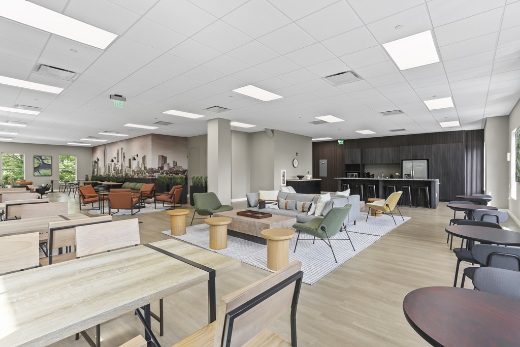 A modern open plan office space with wooden floors and furniture.