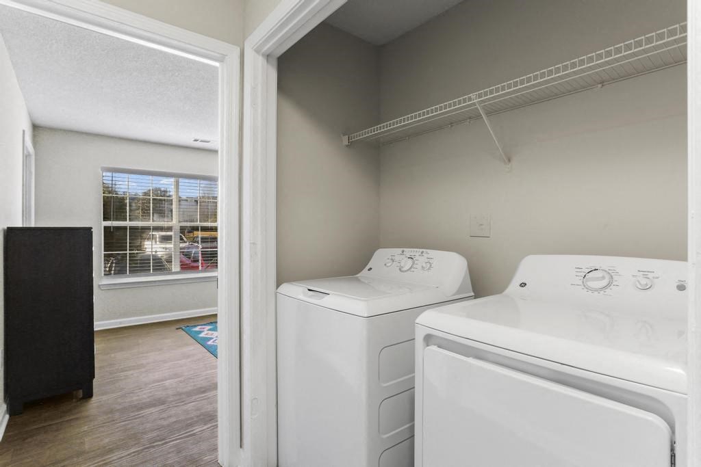 a washer and dryer in a room with a window